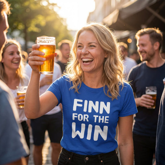 Finn for the Win Finnish sports t-shirt in royal blue worn by a woman celebrating with a beer, Very Finnish Problems