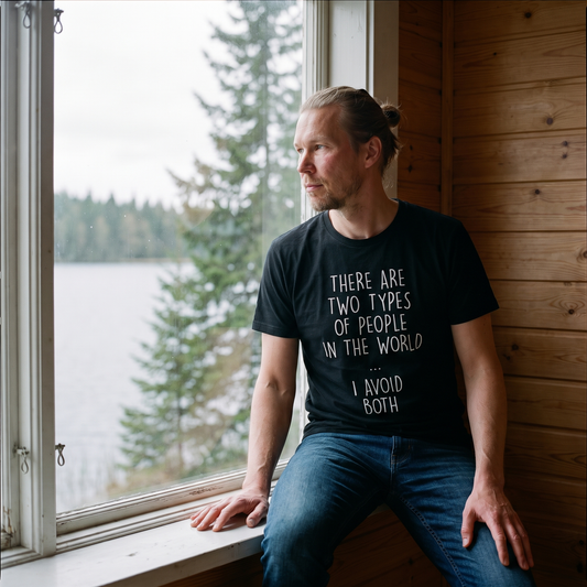 Two Types of People t-shirt in black, worn by a man sitting at a lakeside cottage window, Very Finnish Problems
