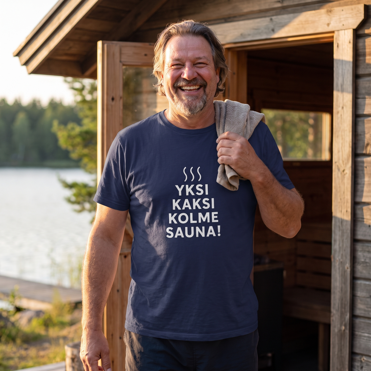 Yksi, kaksi, kolme, sauna! t-shirt in navy, worn by Jojelli stepping out of a lakeside sauna, Very Finnish Problems