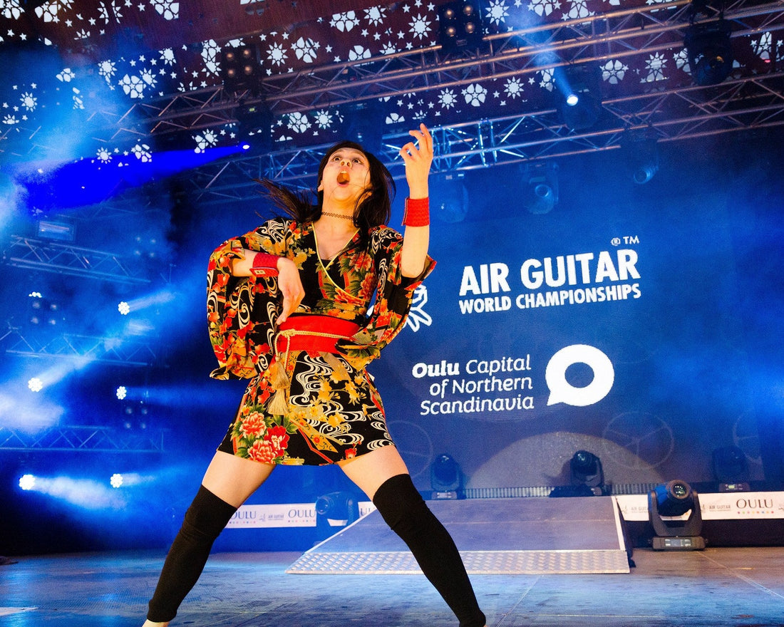 Nanami Nagura mid performance on stage at the Air Guitar World Championships in Oulu, Finland