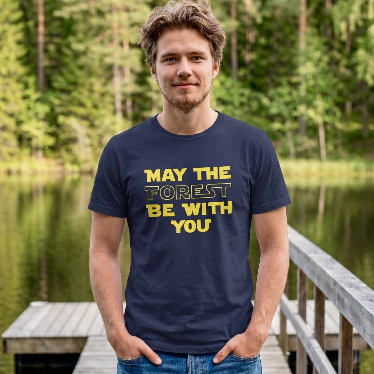 Man on a lakeside jetty wearing the navy May the Forest Be with You t-shirt, Very Finnish Problems