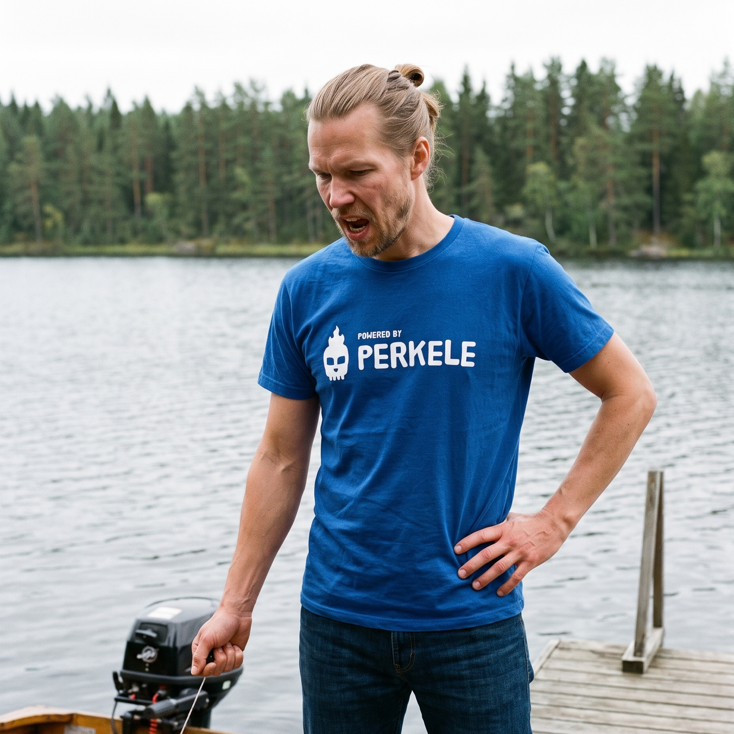 Powered by perkele t-shirt in true royal, worn by Joonas failing to start an outboard motor on a jetty, Very Finnish Problems