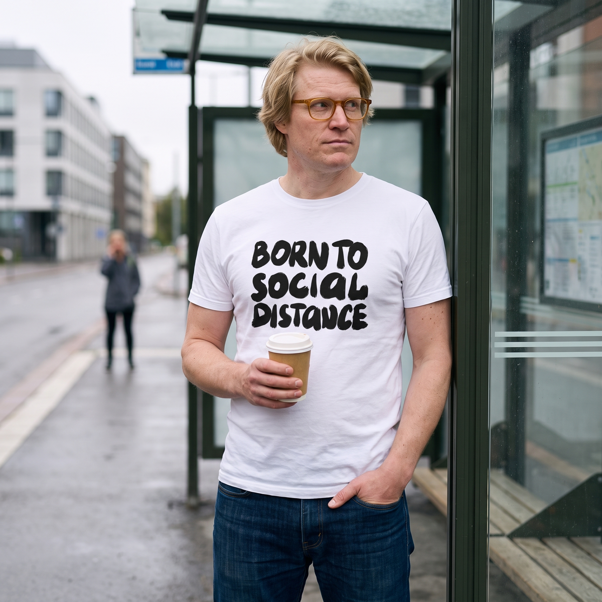 Born to Social Distance t-shirt in white, worn by Tuomas keeping his distance at a Helsinki tram stop, Very Finnish Problems