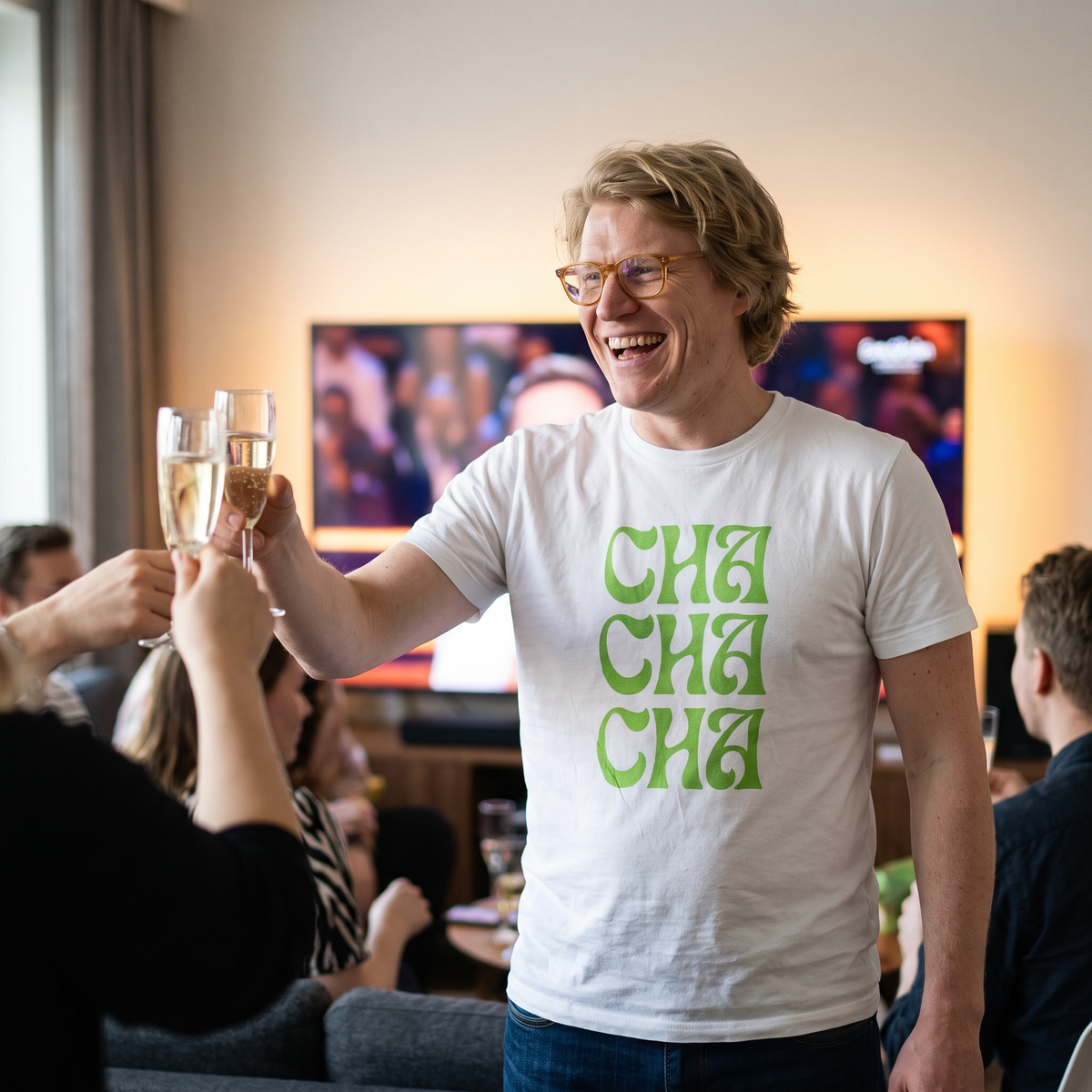 Cha Cha Cha t-shirt in white, worn by Tuomas toasting at a Eurovision party, Very Finnish Problems