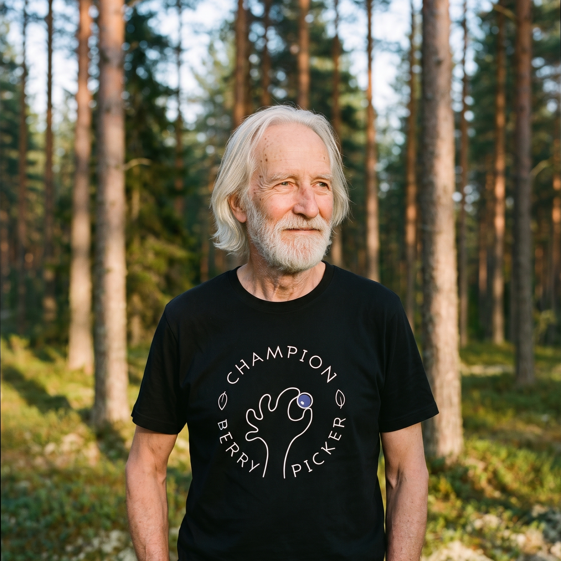 Champion Blueberry Picker t-shirt in black, worn by Pertti in a Finnish pine forest, Very Finnish Problems