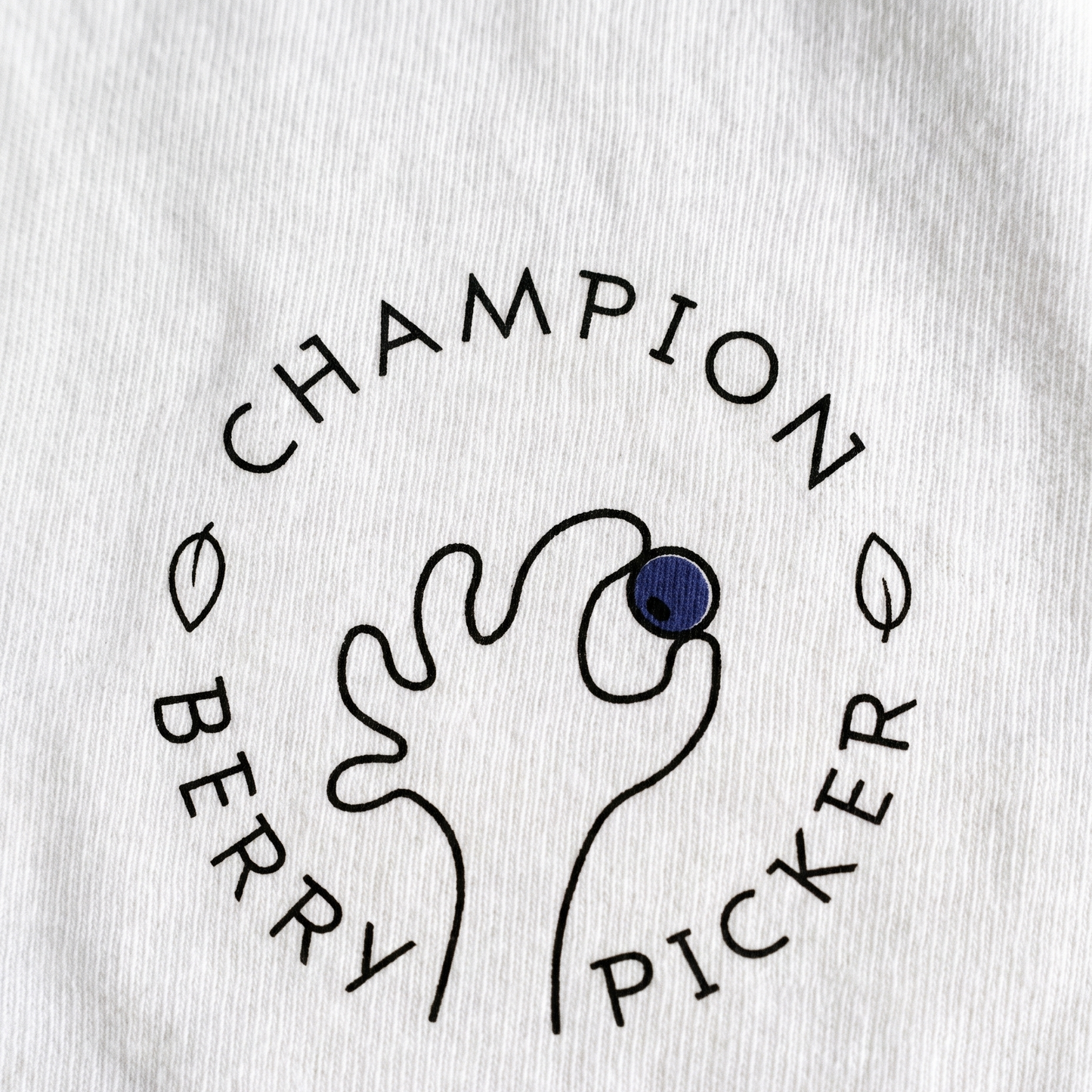 Champion Blueberry Picker print close up on white cotton, Very Finnish Problems