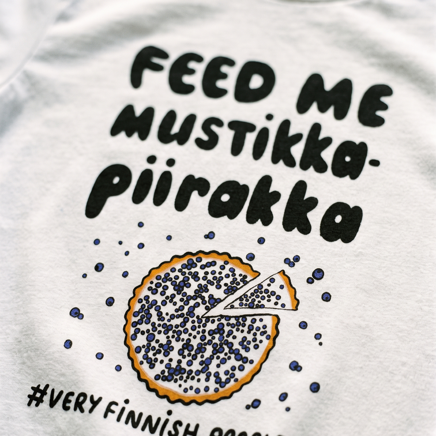 Feed Me Mustikkapiirakka print close up on white cotton, Very Finnish Problems