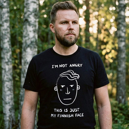 Man in Finnish forest wearing black Finnish Face Humour t-shirt, I'm Not Angry This Is Just My Finnish Face, Very Finnish Problems