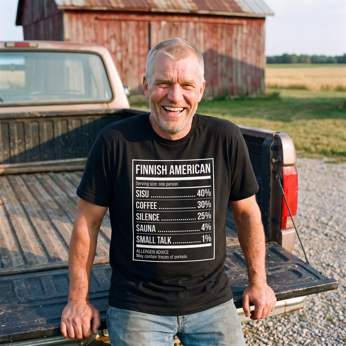 Finnish American Ingredients t-shirt in black, worn by a man on a pickup tailgate outside a red barn in Upper Michigan, Very Finnish Problems