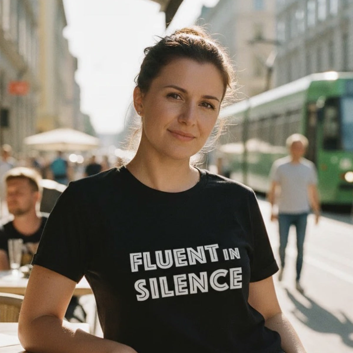 Woman in Helsinki street wearing black Fluent in Silence t-shirt, Very Finnish Problems