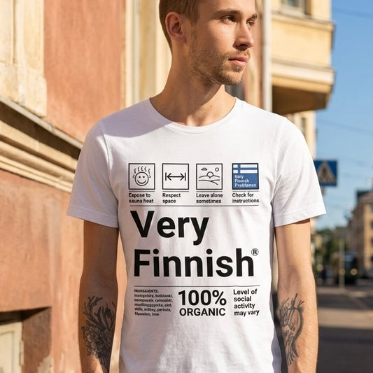 Man on sunny Helsinki street wearing white Very Finnish Service Manual t-shirt
