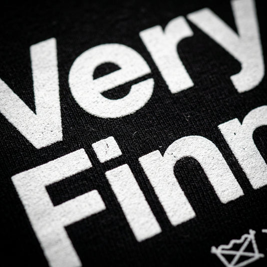 Close-up print detail of Very Finnish Service Manual t-shirt
