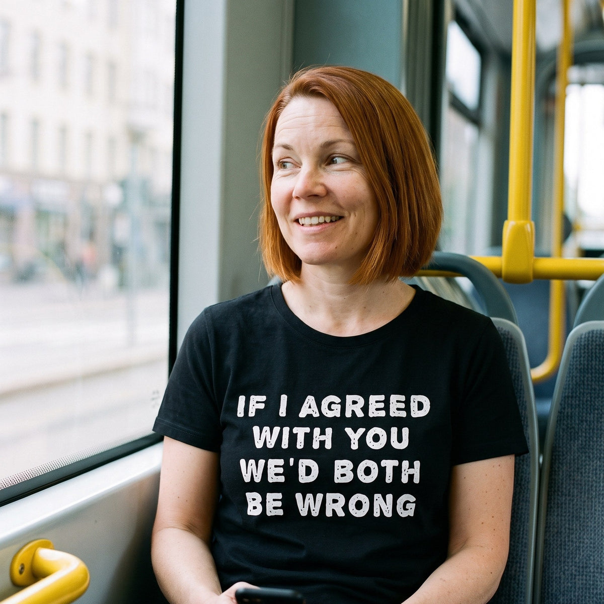 If I agreed with you organic t-shirt in black, worn by Sanna in a window seat on a Helsinki tram, Very Finnish Problems