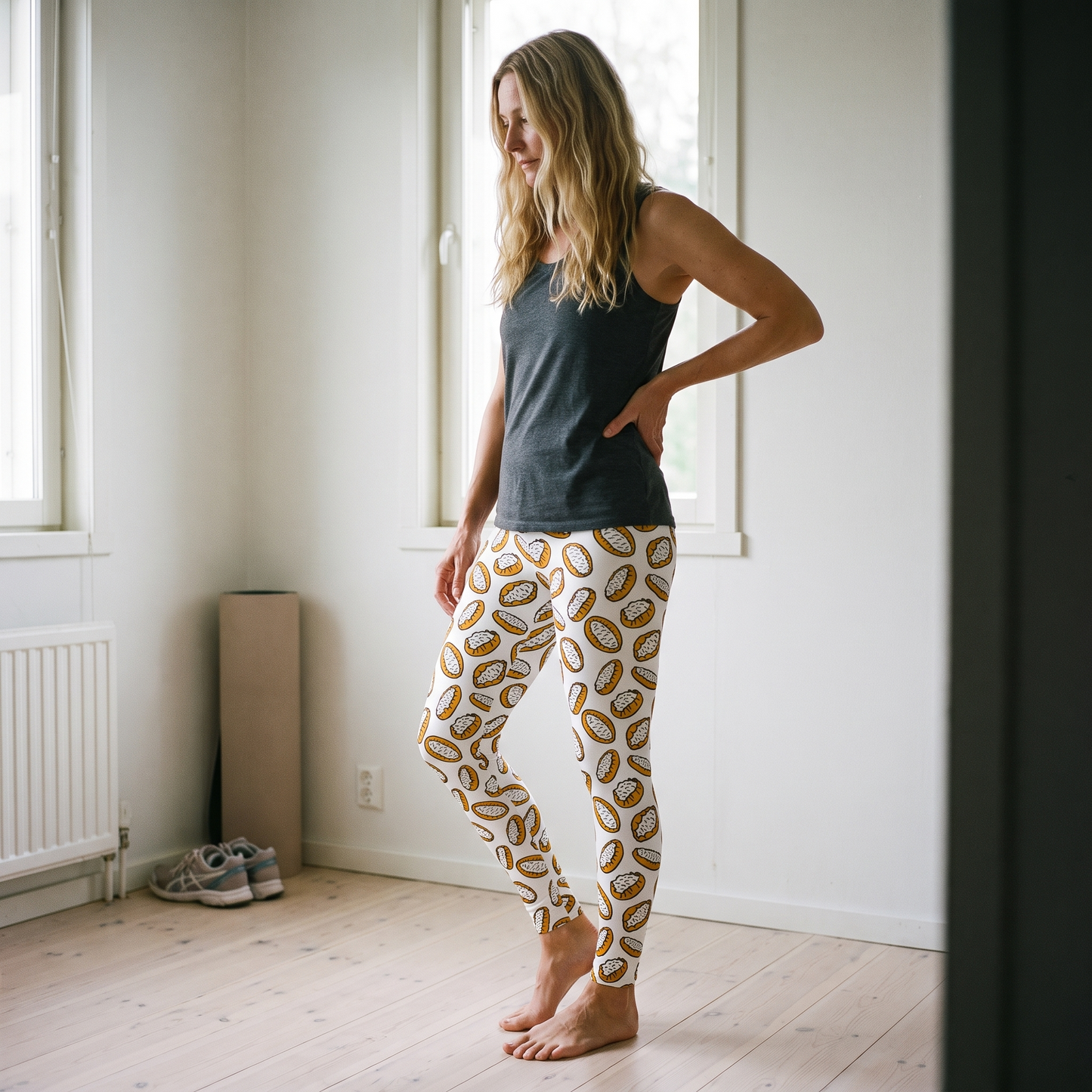 Karelian Pies leggings worn by Elina at home in daylight, all-over Karelian pie print, Very Finnish Problems