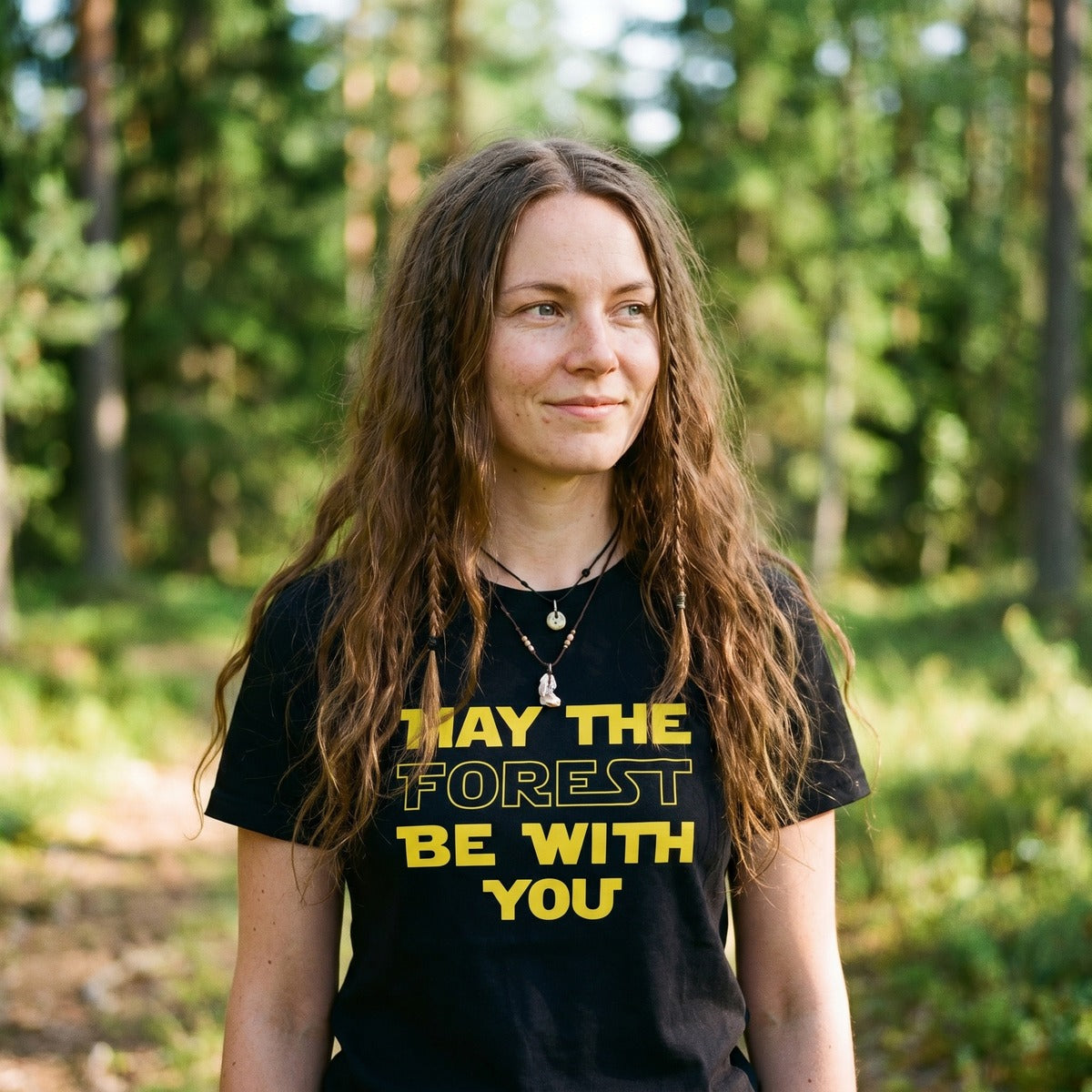 Woman in a Finnish forest clearing wearing the black May the Forest Be with You t-shirt, Very Finnish Problems