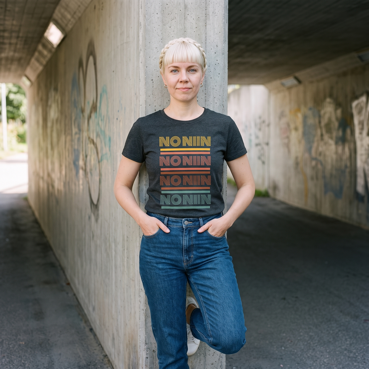 No niin retro Finnish language t-shirt in dark grey heather, worn by Venla in a Finnish concrete underpass, Very Finnish Problems