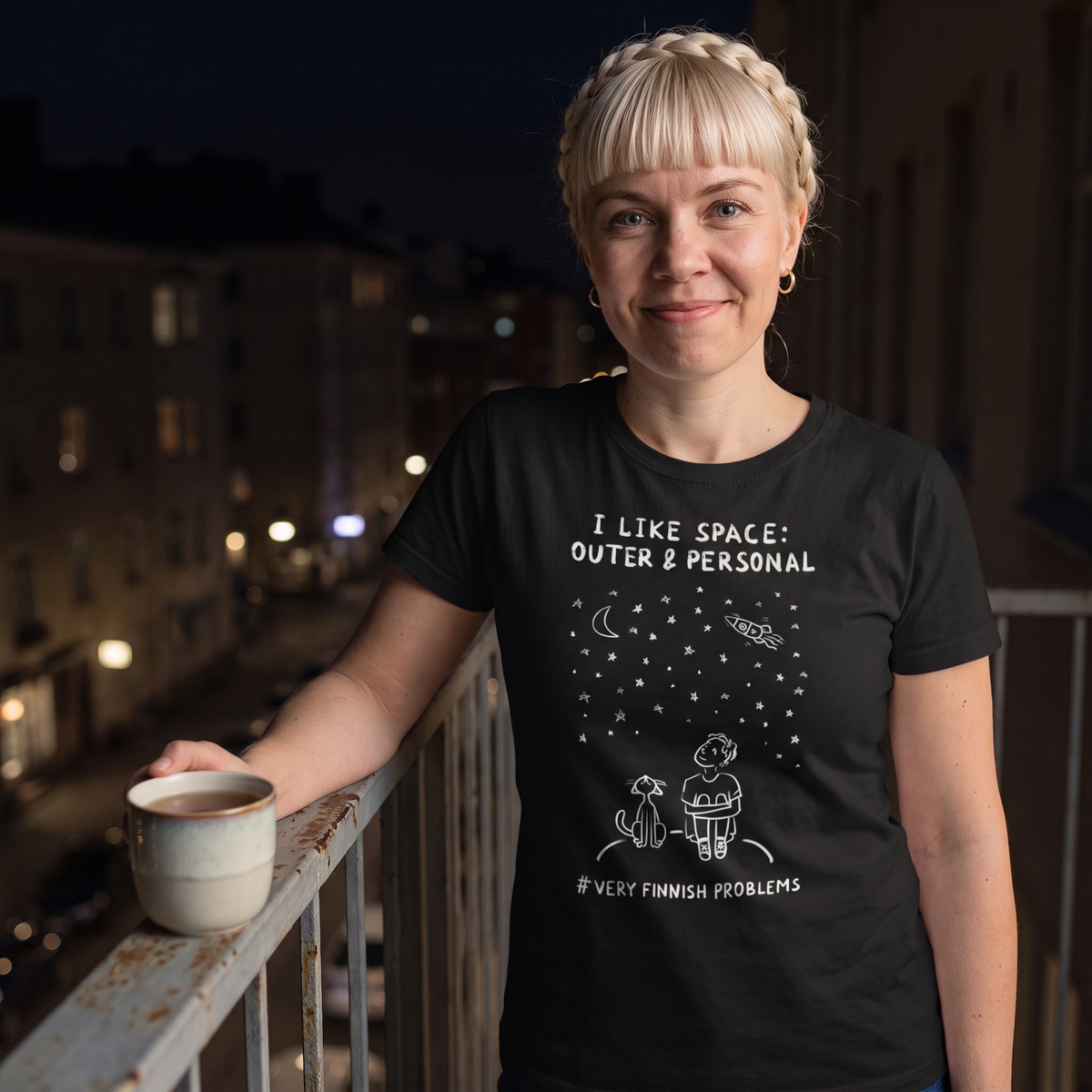 I Like Space: Outer & Personal t-shirt in black, worn by Venla on a night balcony, Very Finnish Problems