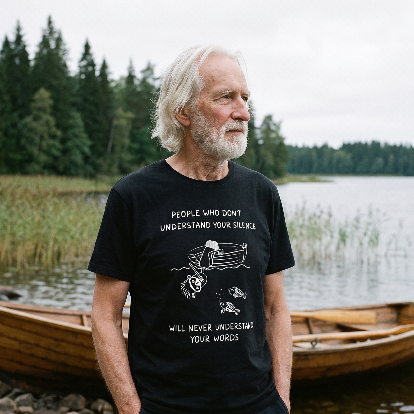 People Who Don't Understand Your Silence t-shirt in black, worn by a man on a Finnish lake shore, Very Finnish Problems