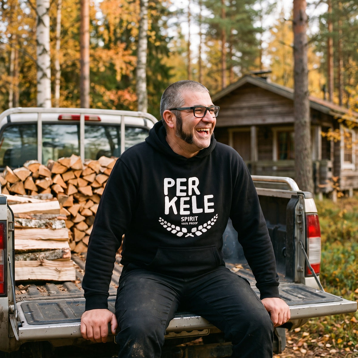 Perkele 100% Proof hoodie in black, worn by Jaska on a pickup tailgate, Very Finnish Problems
