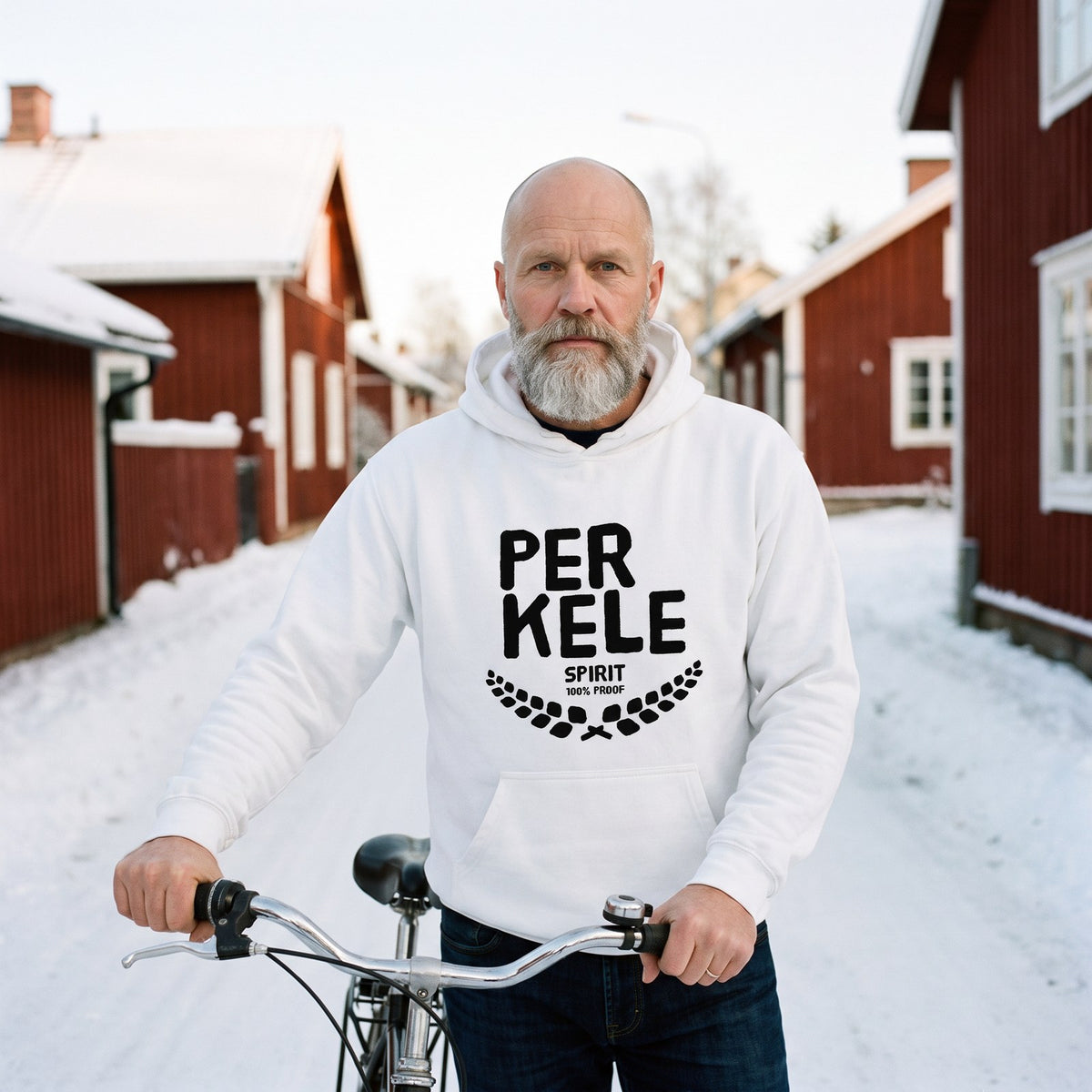 Perkele 100% Proof hoodie in white, worn by Mikko with a bicycle on a snowy lane, Very Finnish Problems
