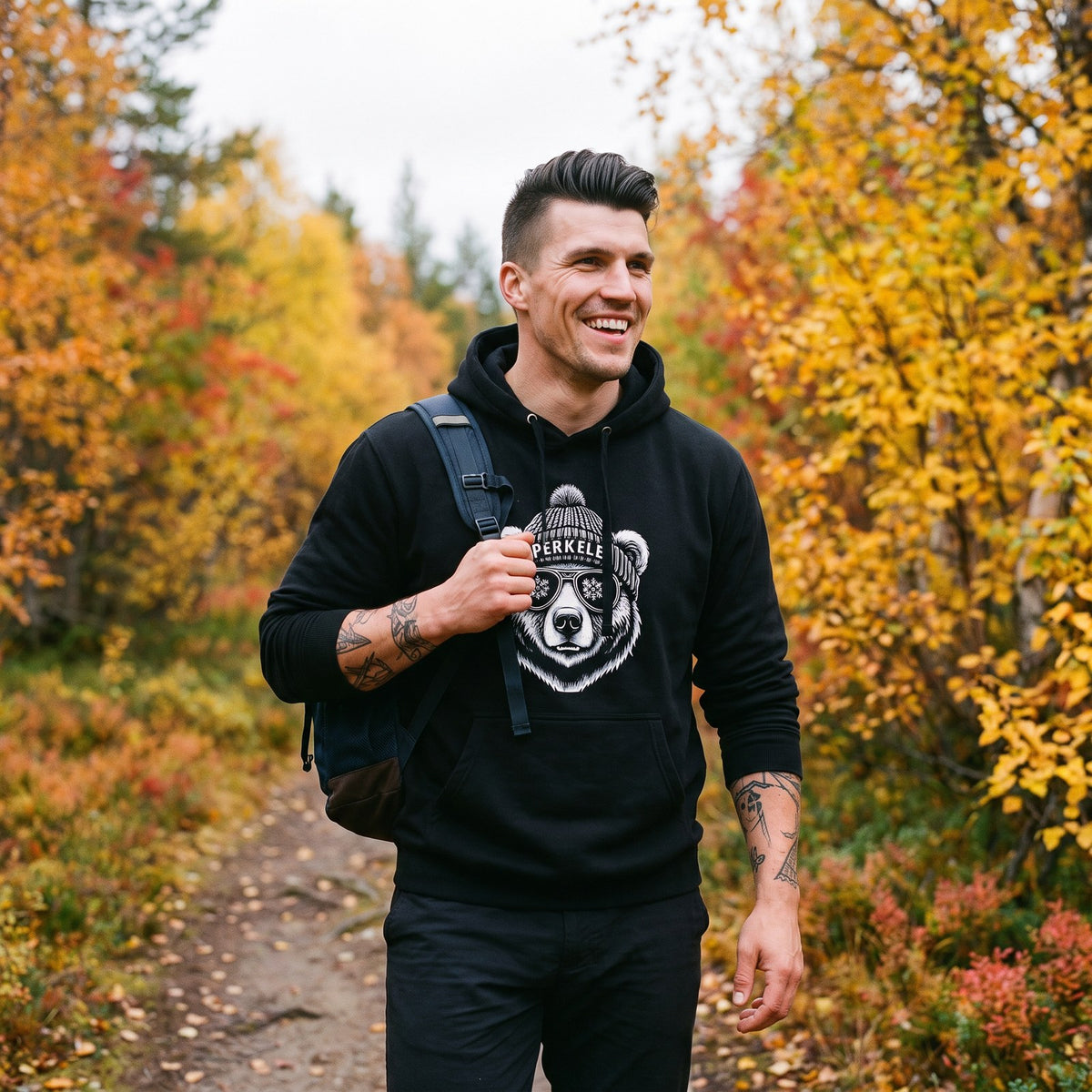 Perkele Bear hoodie in black, worn by Eetu on a Lapland trail, Very Finnish Problems