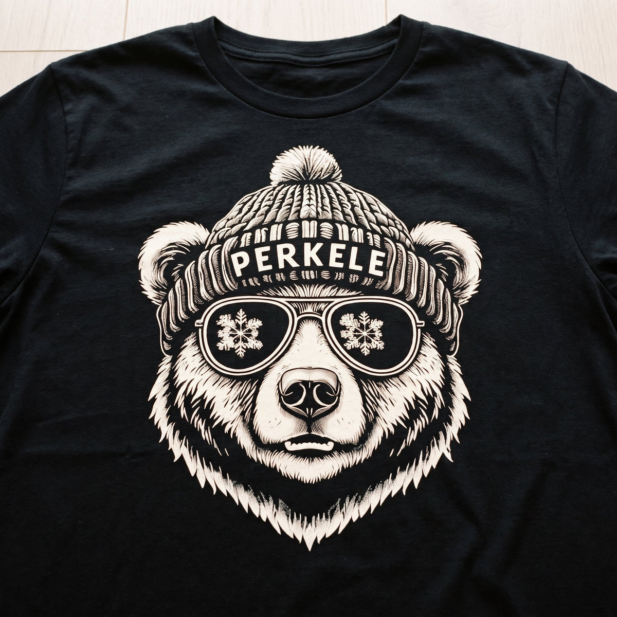 Close-up of the Perkele Bear print on a black t-shirt, Very Finnish Problems
