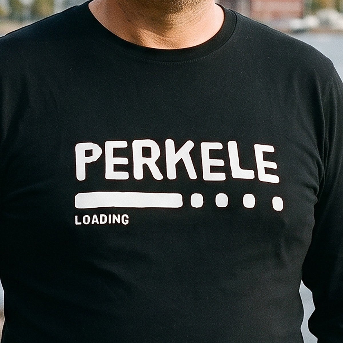 Close-up of the Perkele loading print on black long sleeve tee fabric, Very Finnish Problems