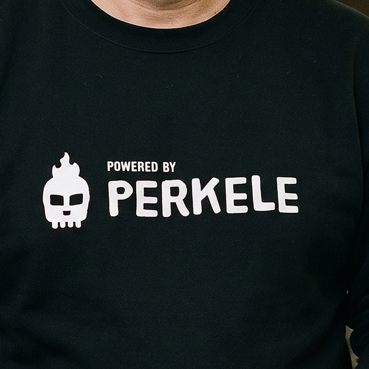 Close-up of the Powered by Perkele print on black sweatshirt fabric, Very Finnish Problems