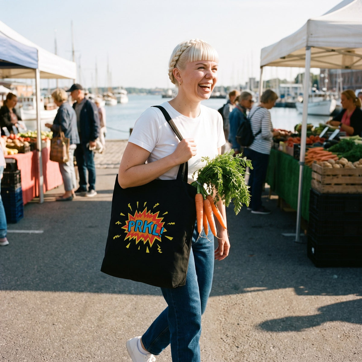 PRKL Bang eco tote bag in black, carried by Venla at the Helsinki harbour market, Very Finnish Problems