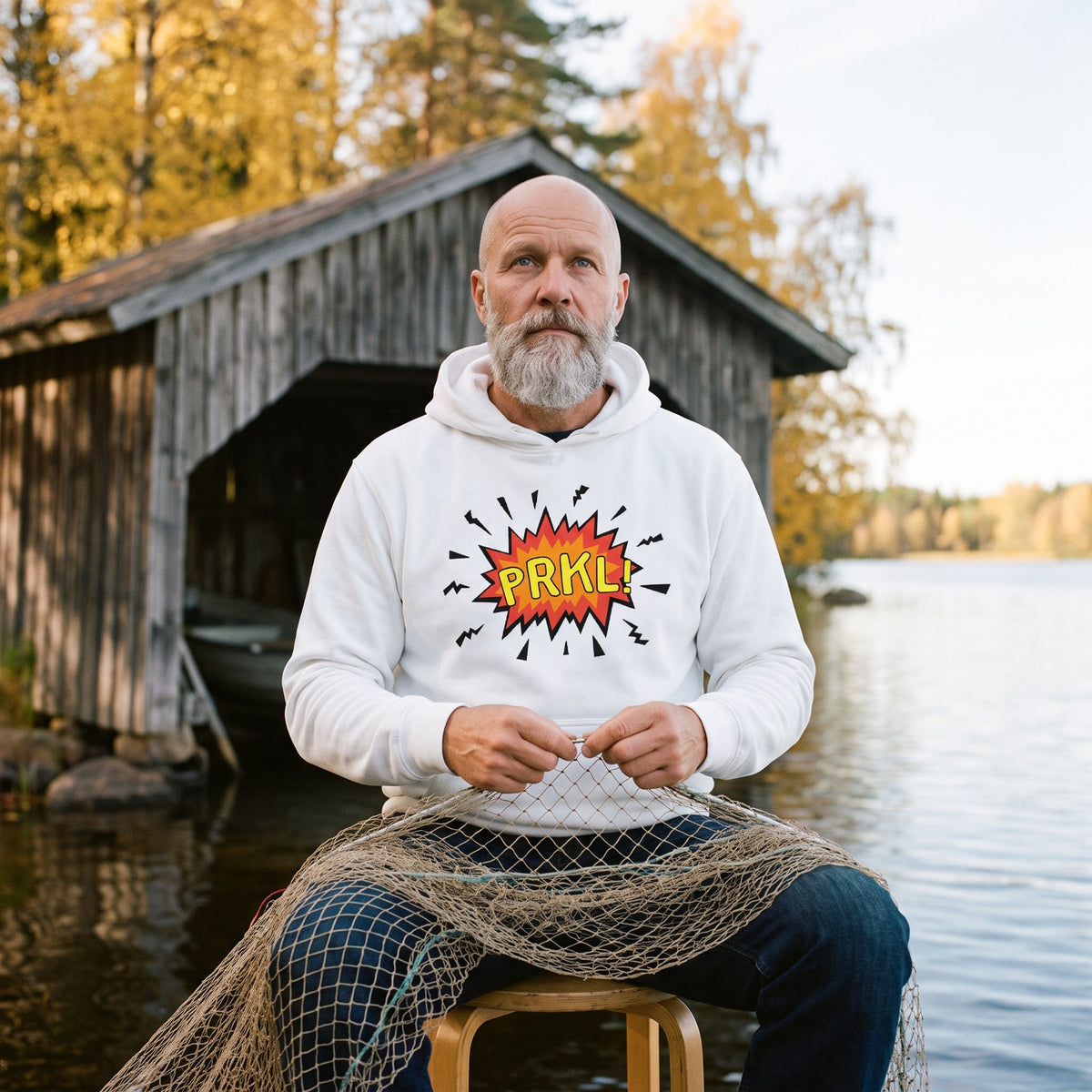 PRKL Bang hoodie in white, worn by Mikko mending a net by a boathouse, Very Finnish Problems