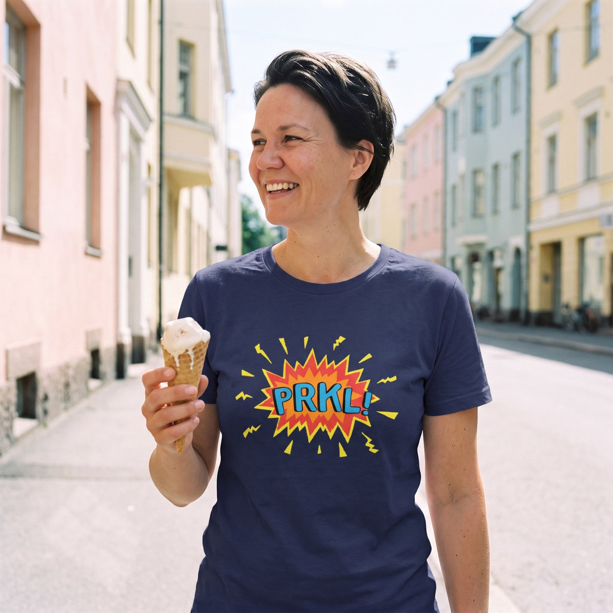 PRKL Bang t-shirt in navy, worn by Katja with an ice cream on a Helsinki street, Very Finnish Problems
