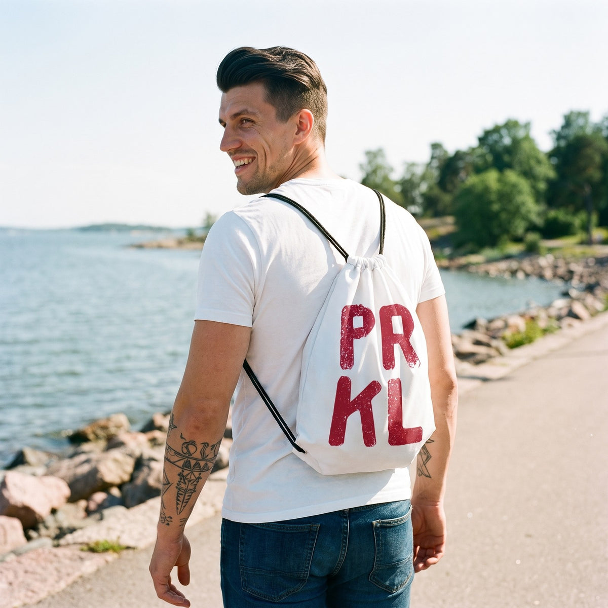 PRKL and PRKL Bang drawstring bag, worn by Eetu on the Helsinki seafront, PRKL side, Very Finnish Problems