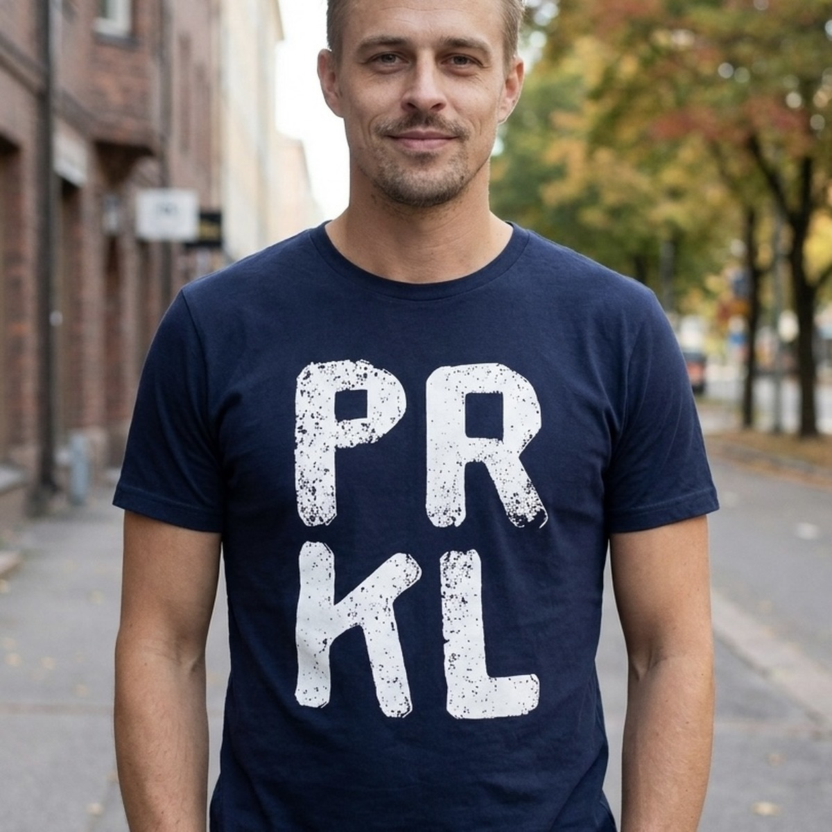 PRKL Finnish language t-shirt in navy, worn on a Helsinki street, Very Finnish Problems