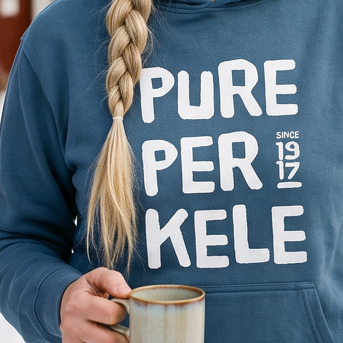 Close-up of the print on the indigo blue Pure Perkele since 1917 hoodie, Very Finnish Problems