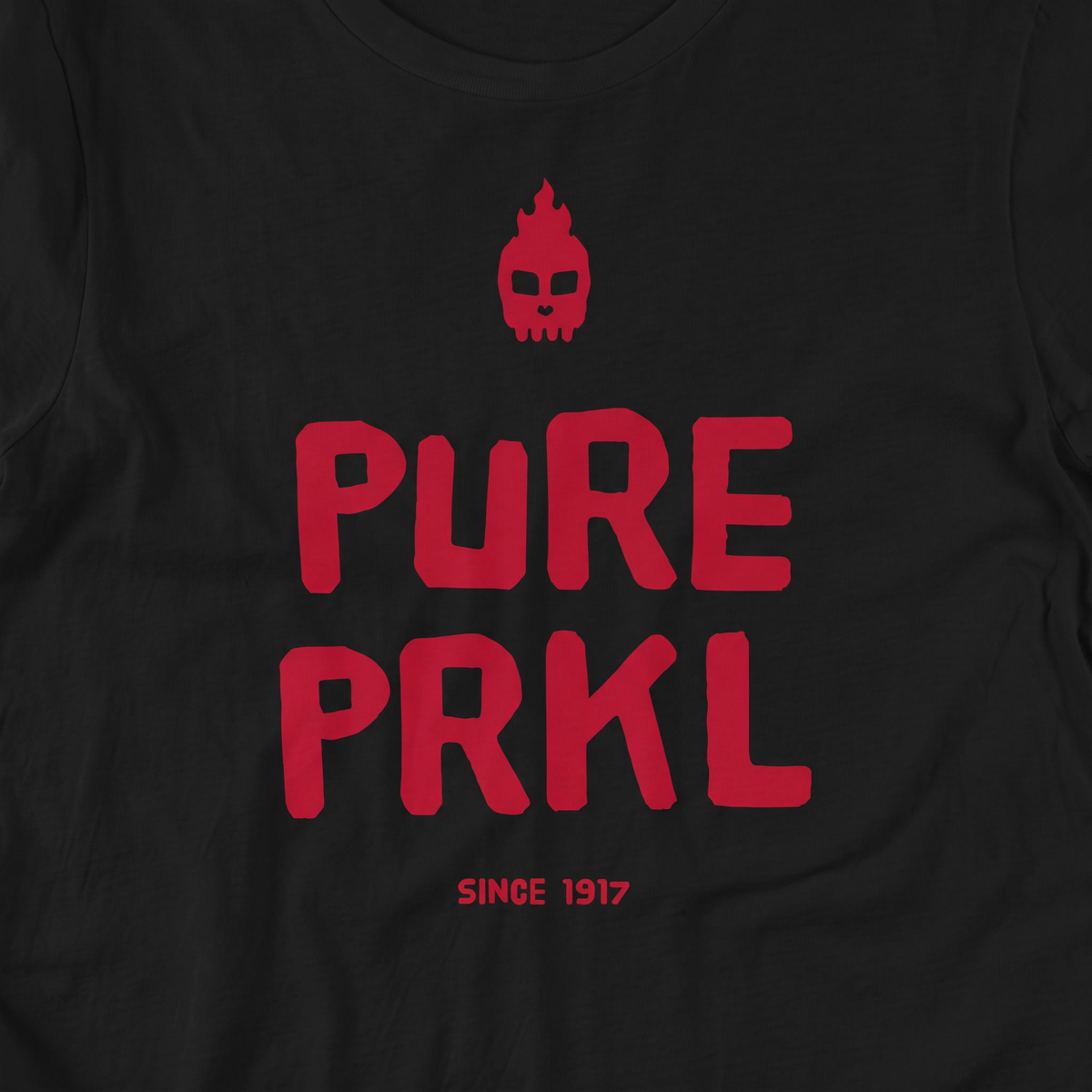 Close-up of the Pure PRKL print on black t-shirt fabric, Very Finnish Problems
