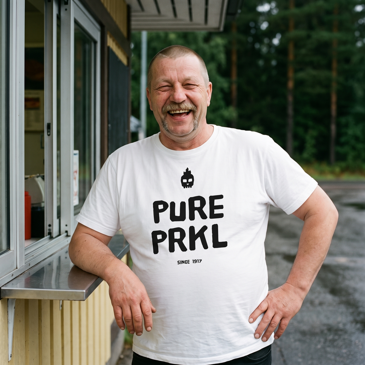 Pure PRKL Finnish language t-shirt in white, worn by Juha at a roadside grill kiosk, Very Finnish Problems