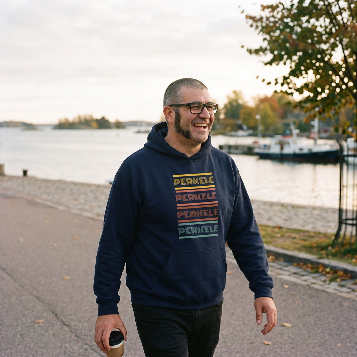 Retro Perkele hoodie in navy, worn by Jaska on the Helsinki seafront, Very Finnish Problems