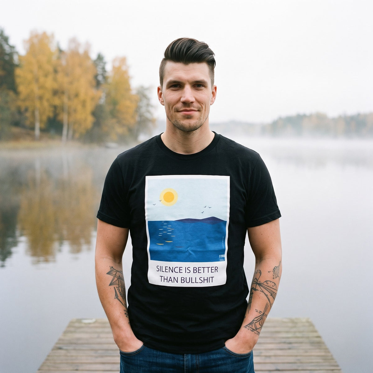 Silence Beats Bullshit t-shirt in black, worn by Eetu on a misty lake jetty, Very Finnish Problems