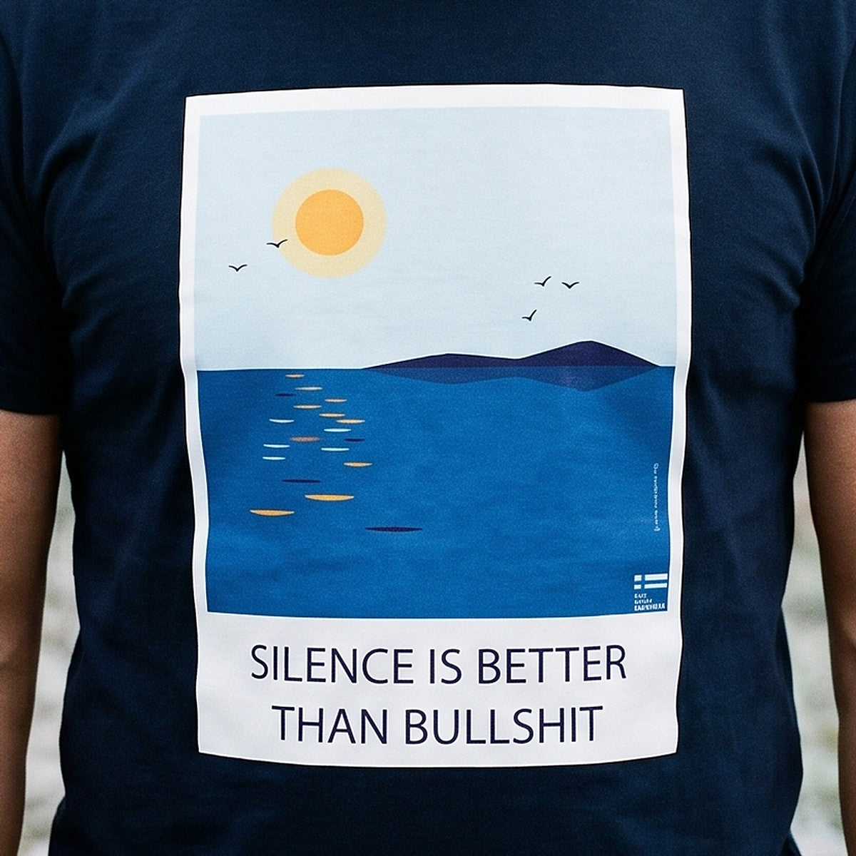 Close-up of the Silence Is Better Than Bullshit print on french navy t-shirt fabric, Very Finnish Problems