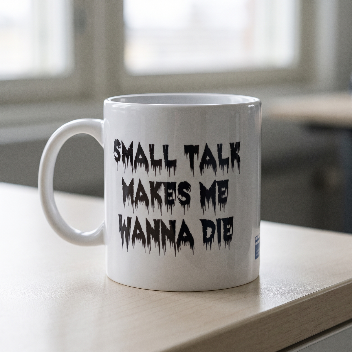 Small Talk mug in white, on an office kitchenette counter, Very Finnish Problems