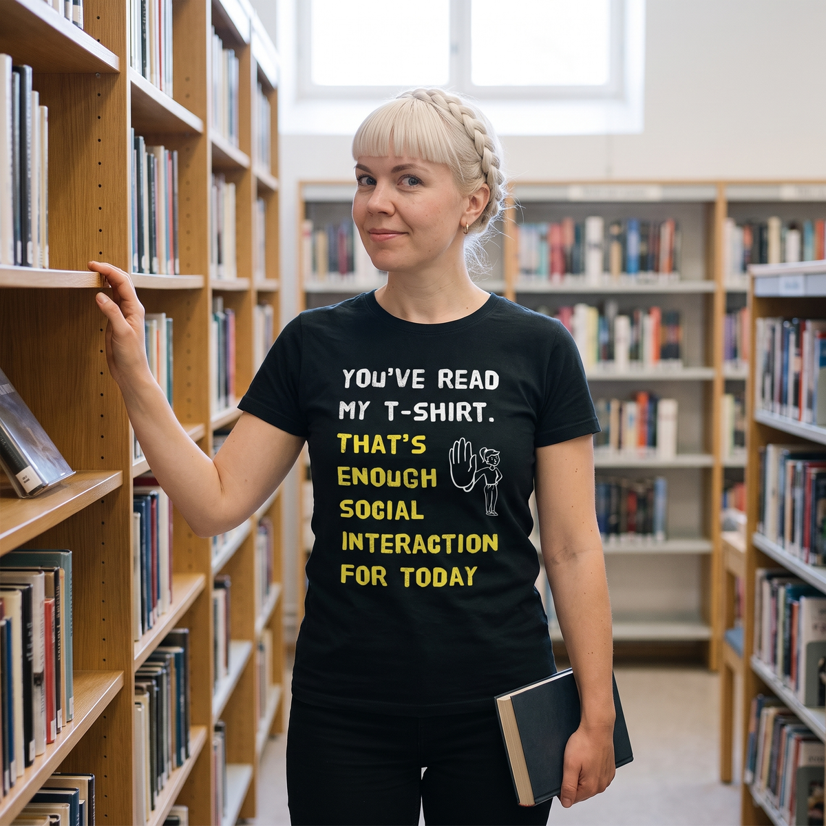 Social Interaction girl Finnish introvert t-shirt in black, worn by Venla in a library aisle, Very Finnish Problems