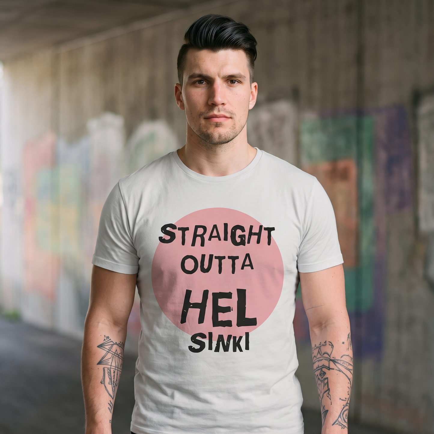 Straight Outta Hel t-shirt in silver grey, worn by Eetu in a concrete underpass, Very Finnish Problems