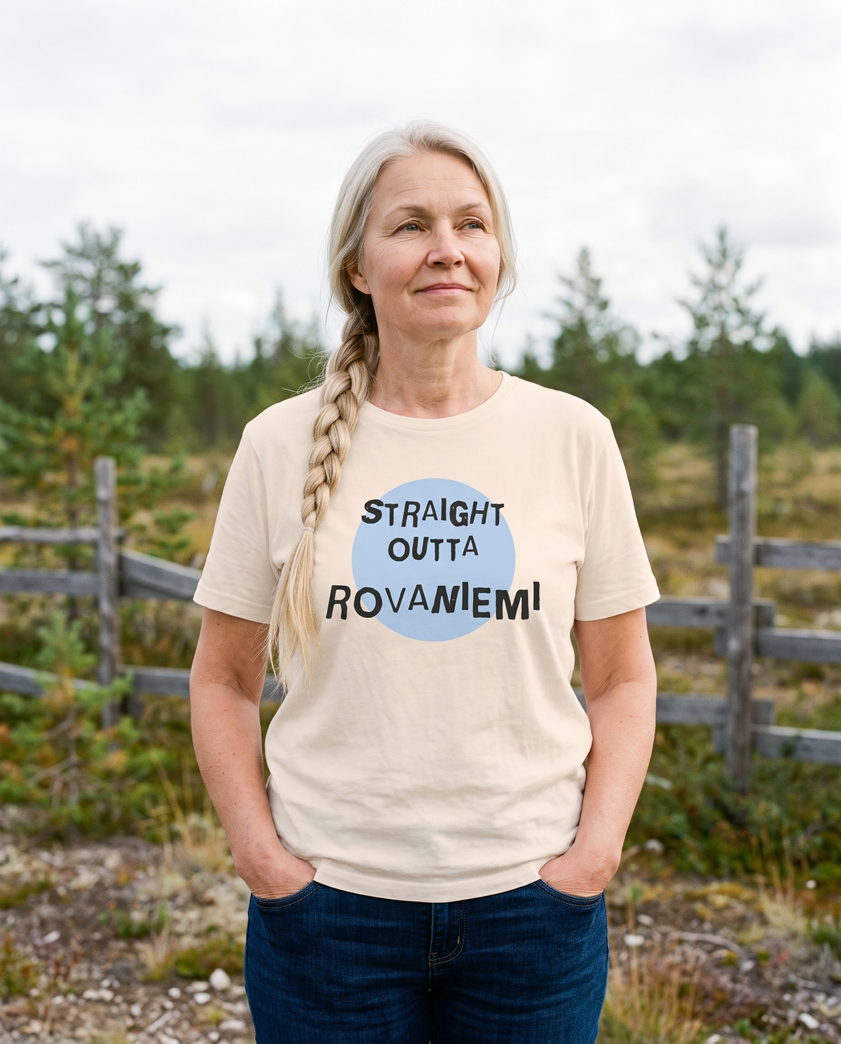 Straight Outta Rovaniemi t-shirt in soft cream, worn by Anneli on open Lapland scrub, Very Finnish Problems