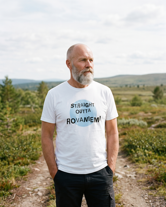 Straight Outta Rovaniemi t-shirt in white, worn by Mikko on a Lapland fell path, Very Finnish Problems