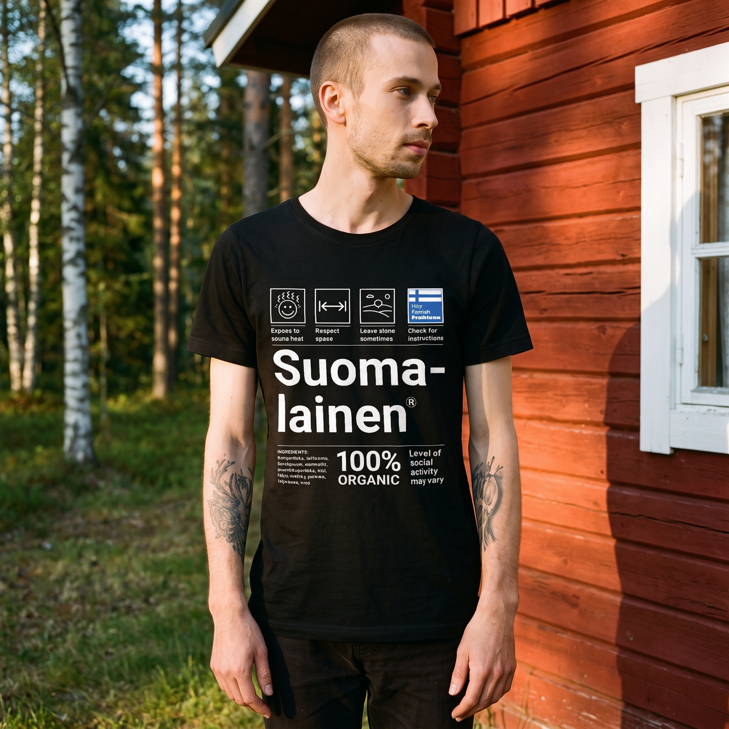 Suomalainen Service Manual t-shirt in black, worn against the falu red timber wall of a Finnish summer cottage, Very Finnish Problems