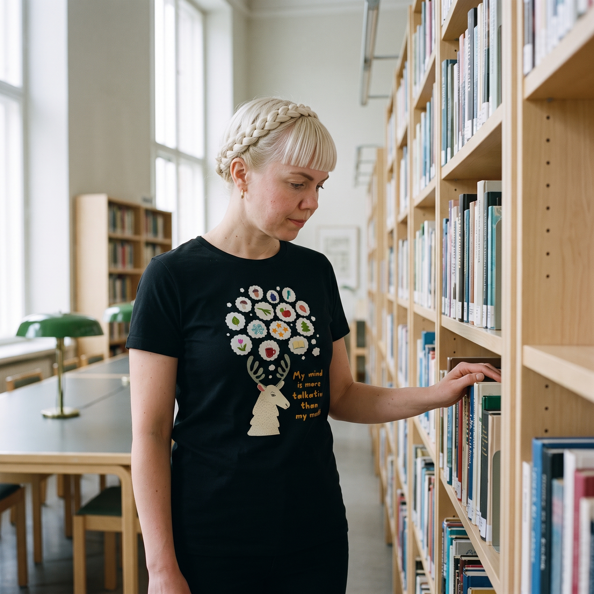 Talkative Mind t-shirt in black, worn by a woman in a library, Very Finnish Problems