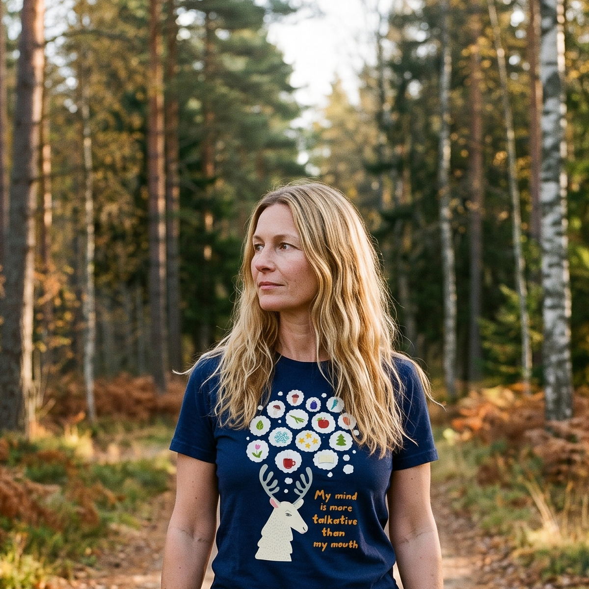 Talkative Mind t-shirt in navy, worn by a woman on an autumn forest track, Very Finnish Problems