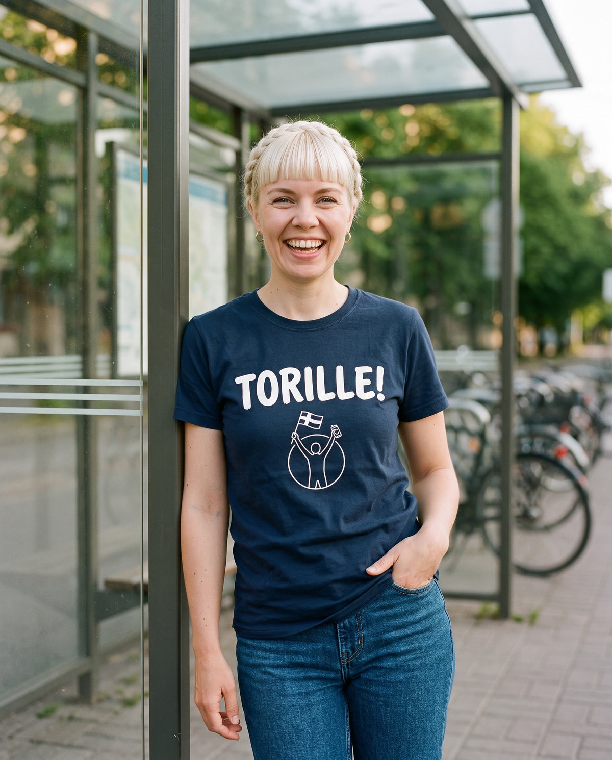 Torille t-shirt in navy, worn by Venla at a Helsinki tram stop on a summer evening, Very Finnish Problems