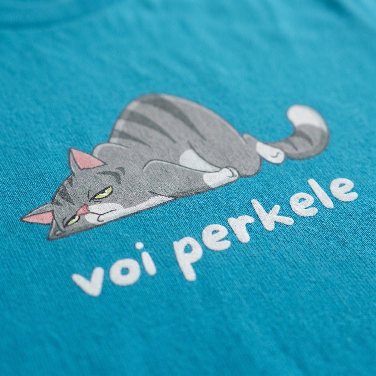 Close-up of the Voi perkele cat print on black t-shirt fabric, Very Finnish Problems