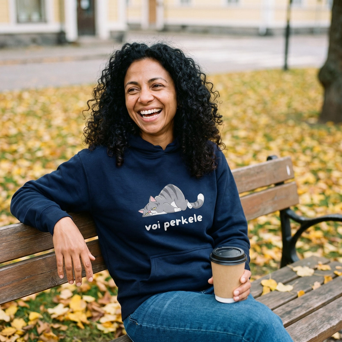 Voi perkele hoodie in navy, worn by Nea on an autumn park bench, Very Finnish Problems